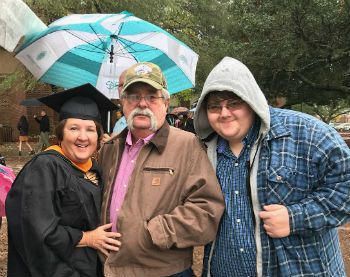 Online MSN graduate Tammy Hussey at graduation with her family